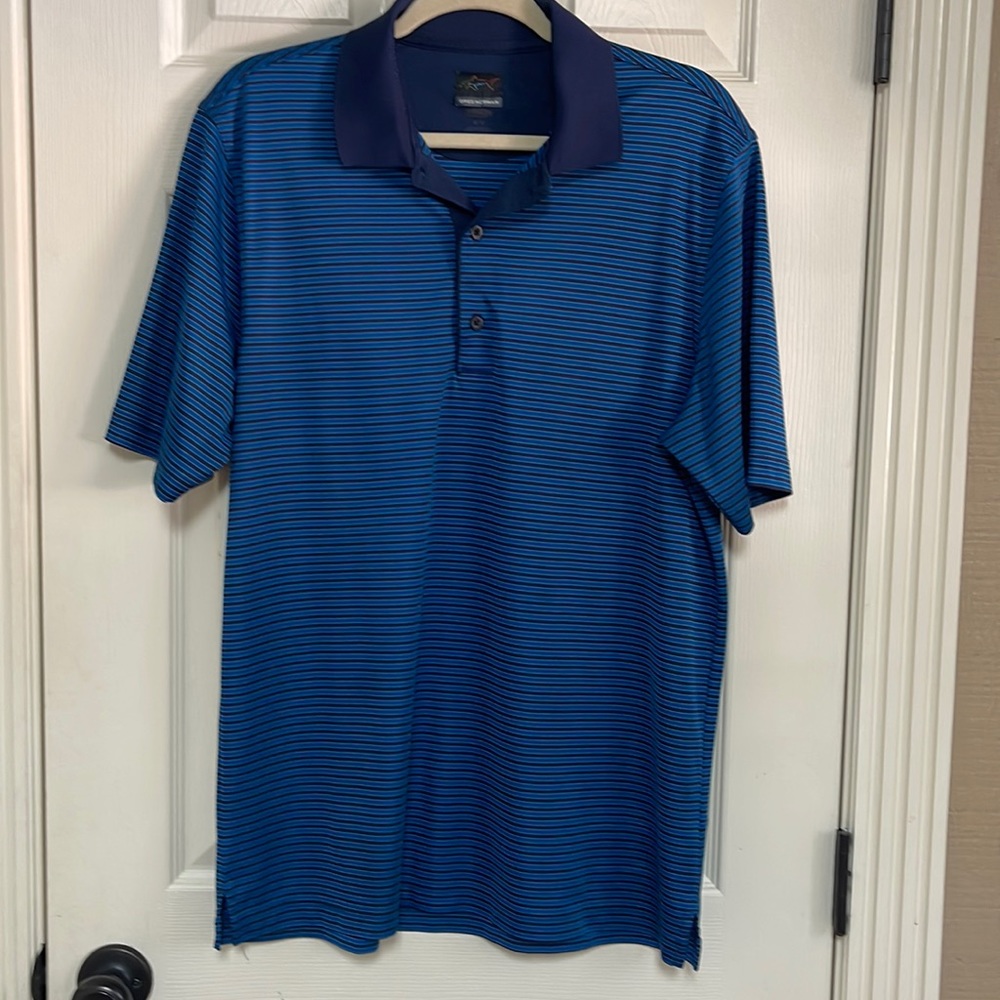Greg Norman shirt. Size medium. Used, but great condition! Navy and royal blue